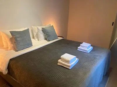 a bed with folded towels on top of it at Luxury Suites Princess by Rikas Hotels in Antwerp