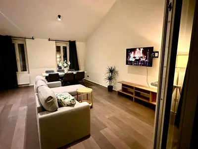 a living room with a couch and a table at Luxury Suites Princess by Rikas Hotels in Antwerp