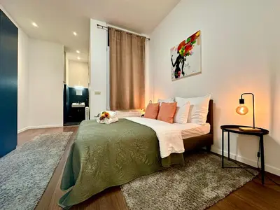 a bedroom with a large bed in a room at Luxury Suites Centrum by Rikas Hotels in Antwerp