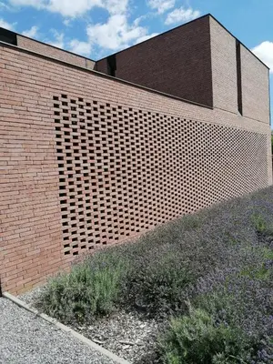 a brick wall with a large opening in the side of a building at Vakantievilla met jacuzzi Limburg in Kwaadmechelen