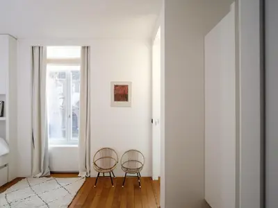 two chairs in a room with a window at CE RESIDENCE in Ghent