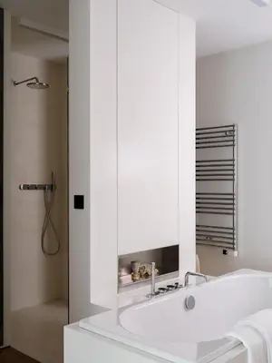 a white bathroom with a sink and a mirror at CE RESIDENCE in Ghent