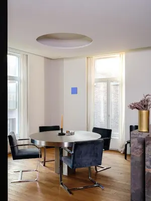 a dining room with a table and chairs at CE RESIDENCE in Ghent