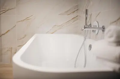 a bathroom with a sink with a faucet at Chambres d'hôtes Eucalyptus et Glycine in Genval