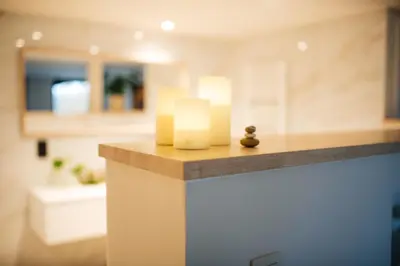 a room with a counter with two candles on it at Chambres d'hôtes Eucalyptus et Glycine in Genval