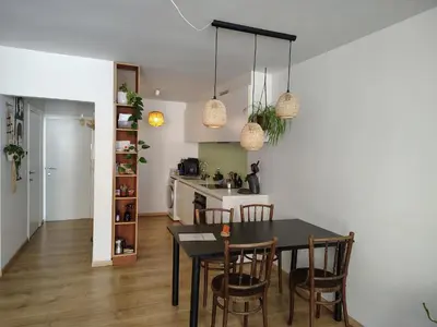a kitchen and dining room with a table and chairs at Cosy Apartment with Big Quiet & Sunny terras in Ghent