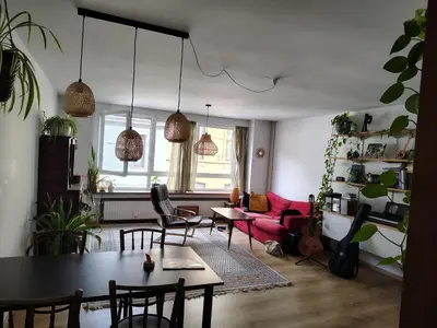a living room with a table and chairs at Cosy Apartment with Big Quiet & Sunny terras in Ghent