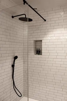 a shower with a glass door in a bathroom at De Kasteelhoeve in Westmalle
