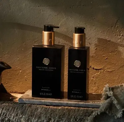 two bottles of soap sitting on a shelf at B&B Art and Sleep in Antwerp