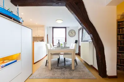 a kitchen and dining room with a table and chairs at B&B Art and Sleep in Antwerp