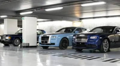 three cars parked in a parking garage at B&B Art and Sleep in Antwerp