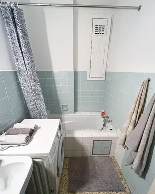 a bathroom with a tub and a sink at Cosy two bedroom apartment in Brussels in Brussels