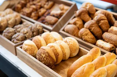 a bunch of different types of donuts in boxes at B&B HOTEL Mechelen in Mechelen