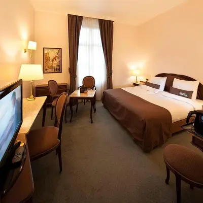 a hotel room with a bed and a flat screen tv at Luxury Pop Up Camping & Hotel Package & Private Transport to Tomorrowland in Schelle