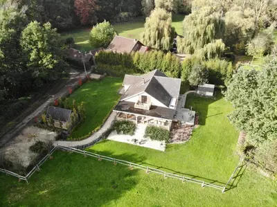 an overhead view of a large house on a green lawn at Huis van luut in Tielt