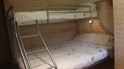 a bunk bed with a ladder in a room at Mezenhof in Brasschaat
