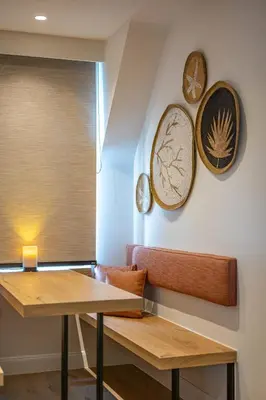 a dining room with two tables and plates on the wall at B&B 't Kloosterveld in Boutersem