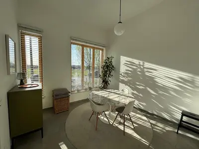 a dining room with a table and two chairs at Luxury apartment, private terrace & FREE PARKING in Antwerp