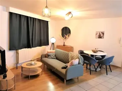a living room with a couch and a table at The Corner in Retie