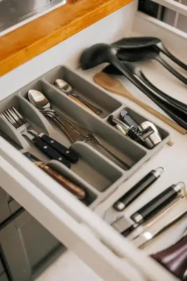 a drawer filled with utensils on a kitchen counter at Cozy Apartment in Brussels in Brussels