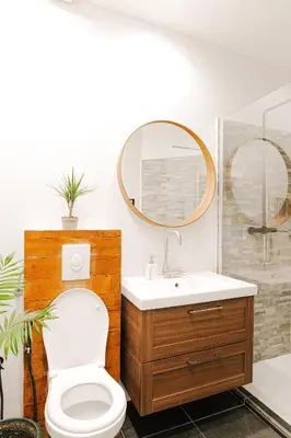 a bathroom with a toilet and a sink and a mirror at Cozy Apartment in Brussels in Brussels