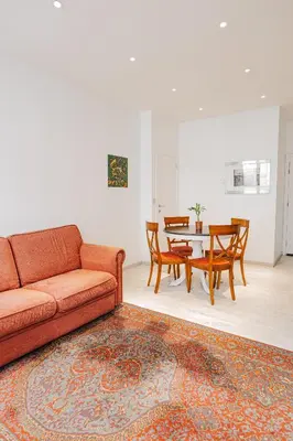 a living room with a couch and a table at Cozy Apartment in Brussels in Brussels