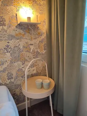 a small table with two cups on it in a bedroom at Studio Anvers in Antwerp