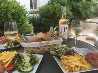 a table with a basket of food and a bottle of wine at Sweet Dreams by Pegase in Vlezenbeek