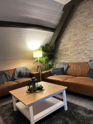 a living room with a couch and a coffee table at Sweet Dreams by Pegase in Vlezenbeek