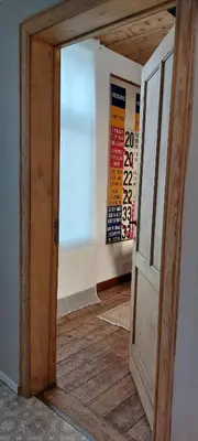 an open door in a room with a wall at De oude statie in Tessenderlo