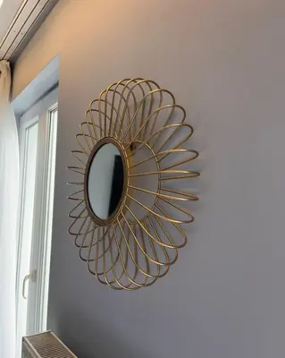a mirror hanging on a wall in a room at Hôtel La Pièce in Brussels