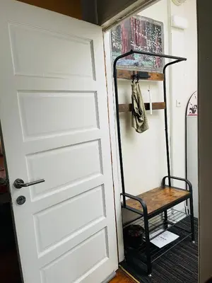 a door leading into a closet with a shelf at Quiet and Colorfull Flat in the Center City of Brussels in Brussels