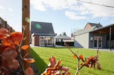 a view of a yard with a house at Holiday Home De Steenen Molen in Brecht