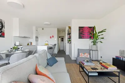 a living room with a couch and a table at Ernest 33 in Antwerp