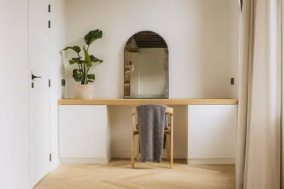 a dressing table in a room with a mirror at Kozy Home Spacious Luxurious home in Antwerp