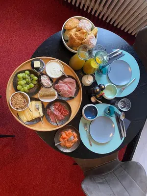 a table with plates of food on top of it at Boutique hotel Sies in Watervliet