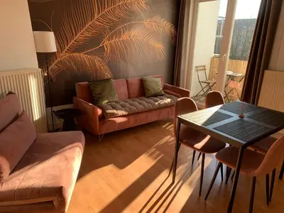 a living room with a couch and a table at Coco’s place in Antwerp