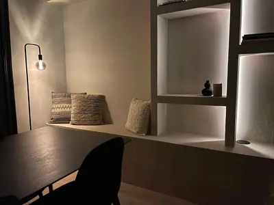 a living room with a bench and a lamp at Historic 3 Bedroom Art-Nouveau Apartment with Airconditioning - Walk to Station Gent Sint-Pieters & Close to City Centre in Ghent