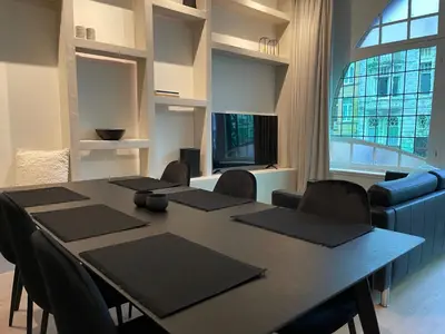 a conference room with a table and chairs and a large window at Historic 3 Bedroom Art-Nouveau Apartment with Airconditioning - Walk to Station Gent Sint-Pieters & Close to City Centre in Ghent
