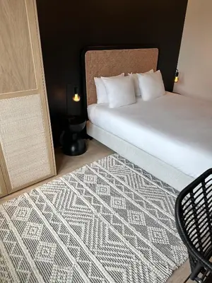 a bedroom with a bed and a carpet at Historic 3 Bedroom Art-Nouveau Apartment with Airconditioning - Walk to Station Gent Sint-Pieters & Close to City Centre in Ghent
