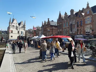a group of people walking down a city street at Het Maelslot (Mechelen) in Mechelen