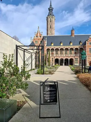 a large building with a sign in front of it at Het Maelslot (Mechelen) in Mechelen