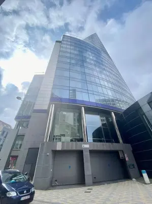 a tall building with a car parked in front of it at Studio hypercentre Bruxelles in Brussels