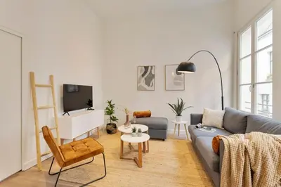 a living room with a couch and a tv at Beautiful cosy apartments in the heart of Antwerp in Antwerp