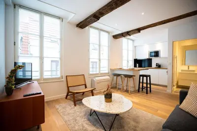 a living room with a couch and a table at Beautiful cosy apartments in the heart of Antwerp in Antwerp