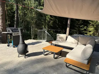 a living room with a couch and a grill at TerraVenturia - Defcamp in Rixensart