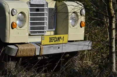 a yellow license plate on the front of a truck at TerraVenturia - Defcamp in Rixensart