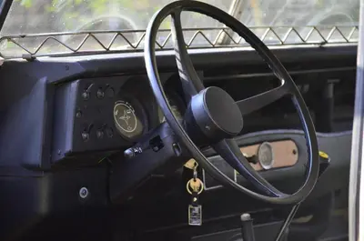 a dashboard of a car with a steering wheel at TerraVenturia - Defcamp in Rixensart