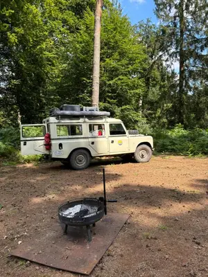 a white jeep parked in a field with a grill at TerraVenturia - Defcamp in Rixensart