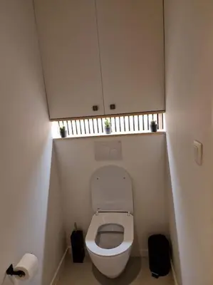a small bathroom with a toilet in a stall at Phoenix in Ghent